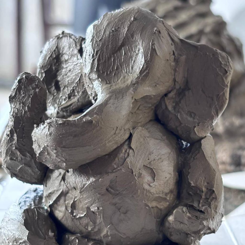 Handcrafted ceramic bust showing realistic clay modeling.