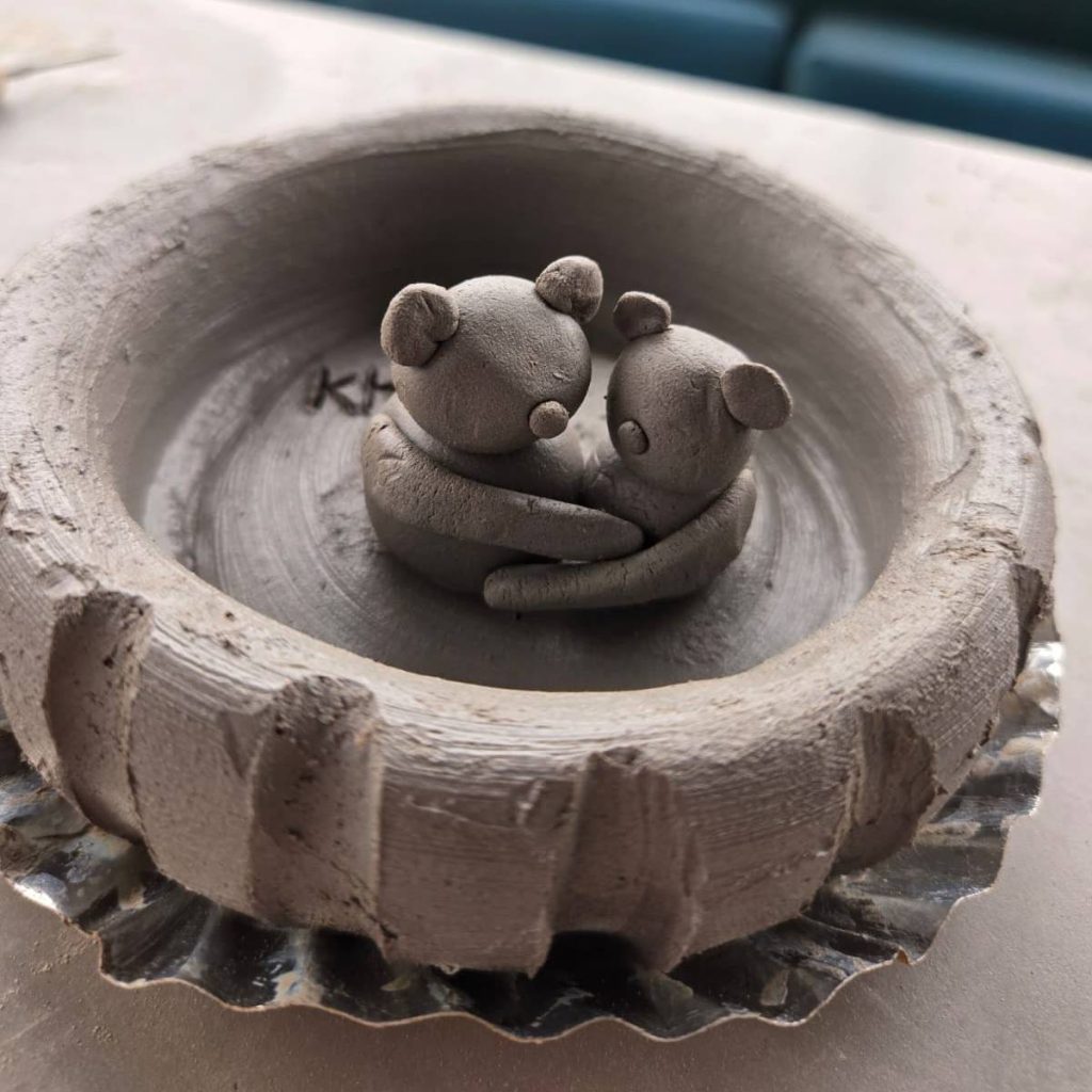 Textured pottery carving art showing delicate craftsmanship.