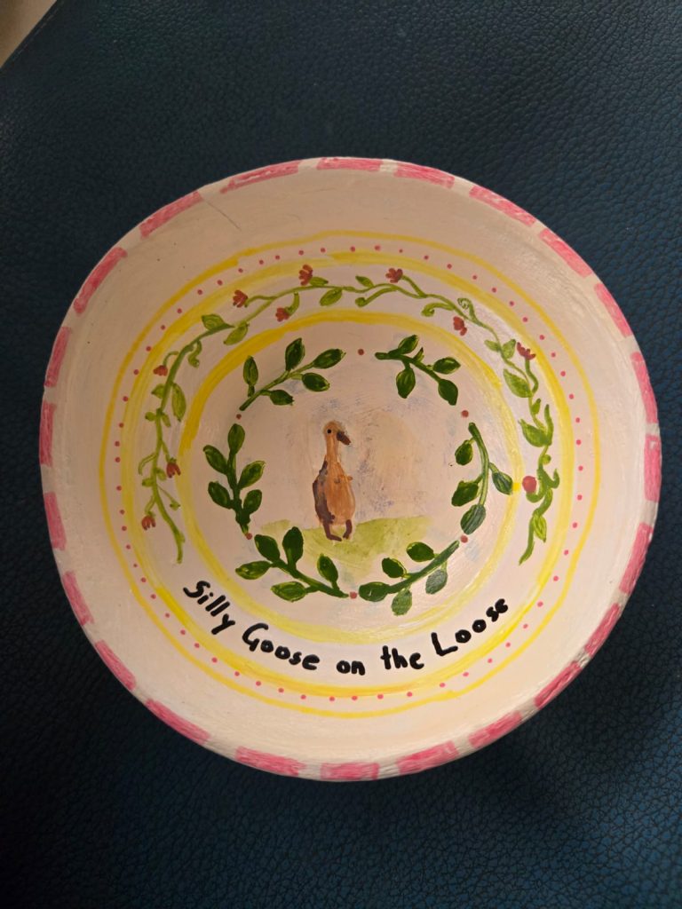 Decorative ceramic plate hand-painted with unique pastel art.