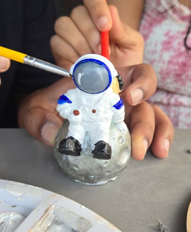 DIY pottery painting ideas with custom designs and soft colors.