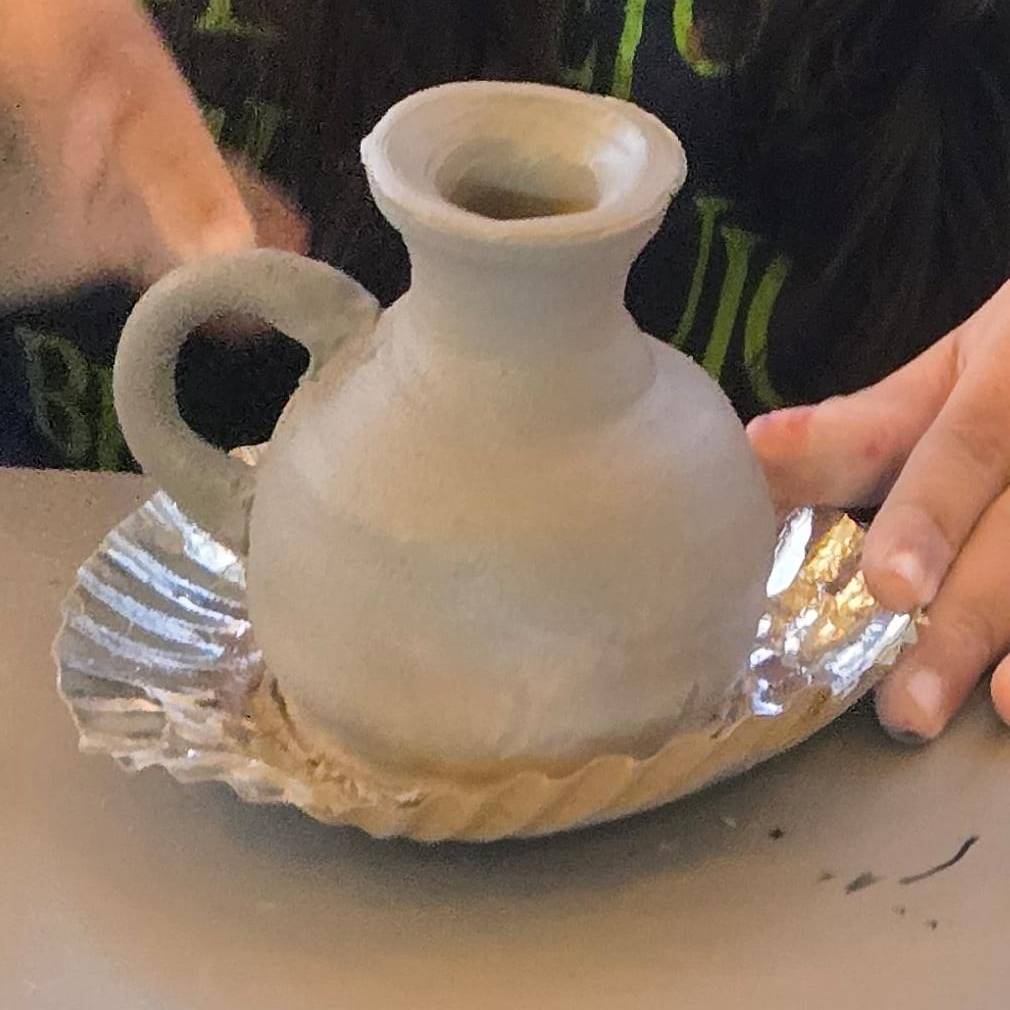 Detailed pottery carving patterns in modern ceramic art.