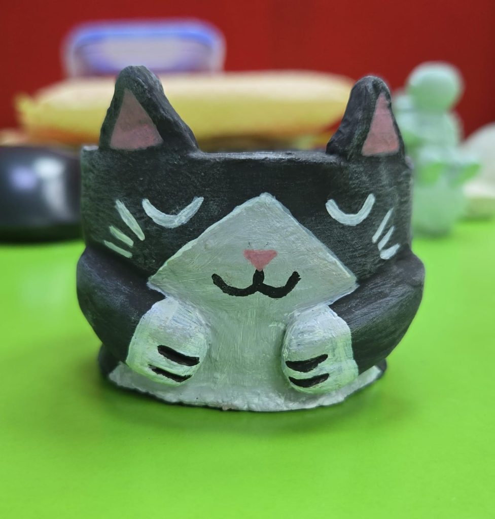 Kids enjoying pottery painting with fun and colorful results.