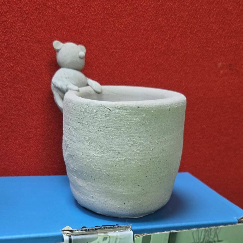 Unique pottery sculpture display showcasing handmade ceramic art.