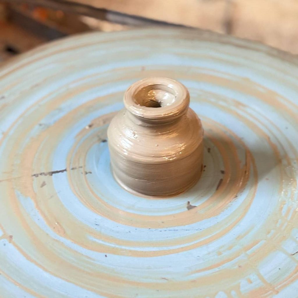 Traditional pottery sculpting methods preserved in modern art.